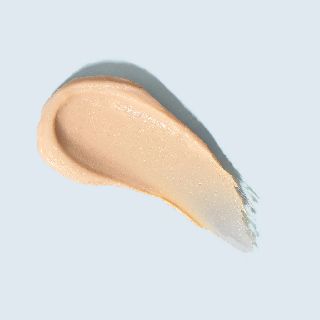 Swatch of Tizo Mineral Stick tinted sunscreen SPF 45 with sheer universal tint and light beige color on light background