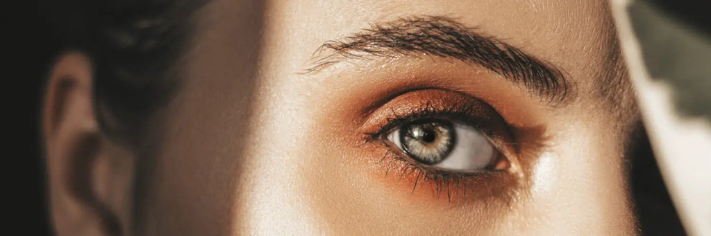 Close-up of a woman's eye with smooth under-eye skin, showcasing Sugarmoon® eye cream benefits